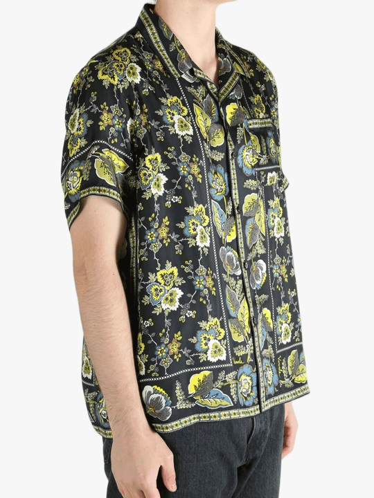 Black shirt worn by a person, showing the shirt's fit