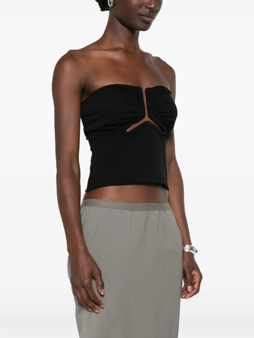 Black top worn by a person, showing the top fit