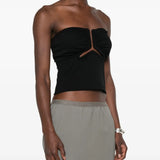 Black top worn by a person, showing the top fit