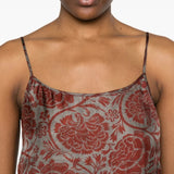 Close up of red dresses, showing texture of the viscose and cupro fabric