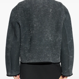 grey jacket worn by a person, showing the jacket fit