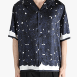 Blue shirt worn by a person, showing the shirt's fit