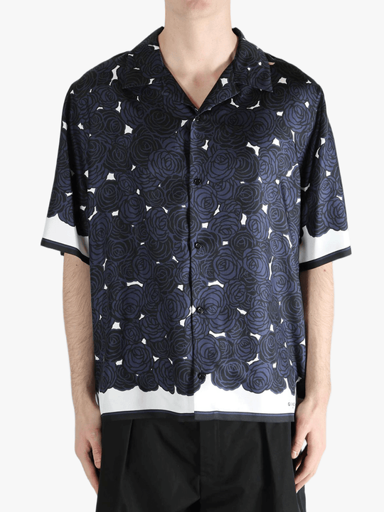 Blue shirt worn by a person, showing the shirt's fit