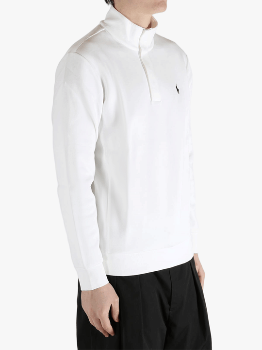 White pullover worn by a person, showing the pullover's fit