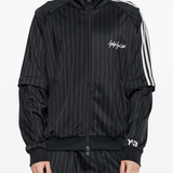 black jackets-coats worn by a person, showing the  jackets-coats fit