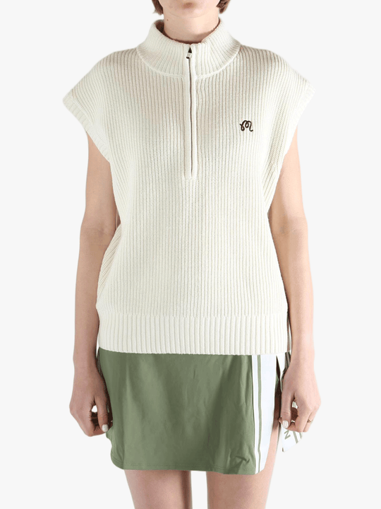White vest worn by a person, showing the loose fit.