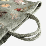 Close up of green bag,showing texture of the wool fabric