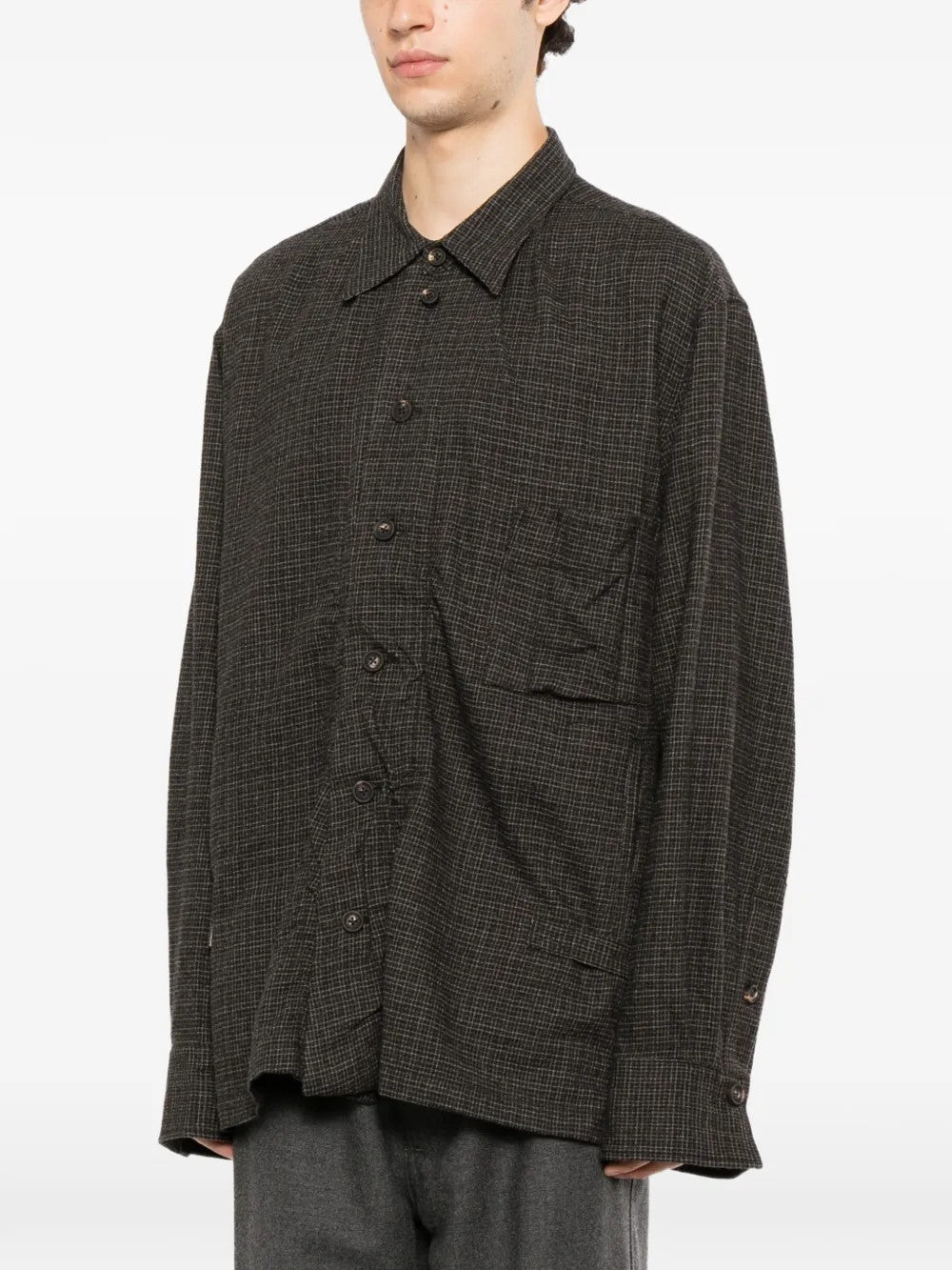Grey shirt worn by a person, showing the shirt fit