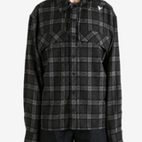Black shirt worn by a person, showing the shirt fit
