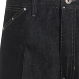 Close up of black pant, showing texture of the cotton fabric