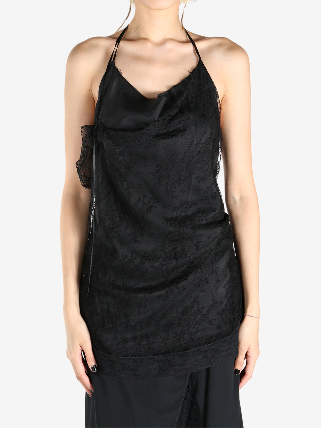 Black tops worn by a person, showing the tops fit