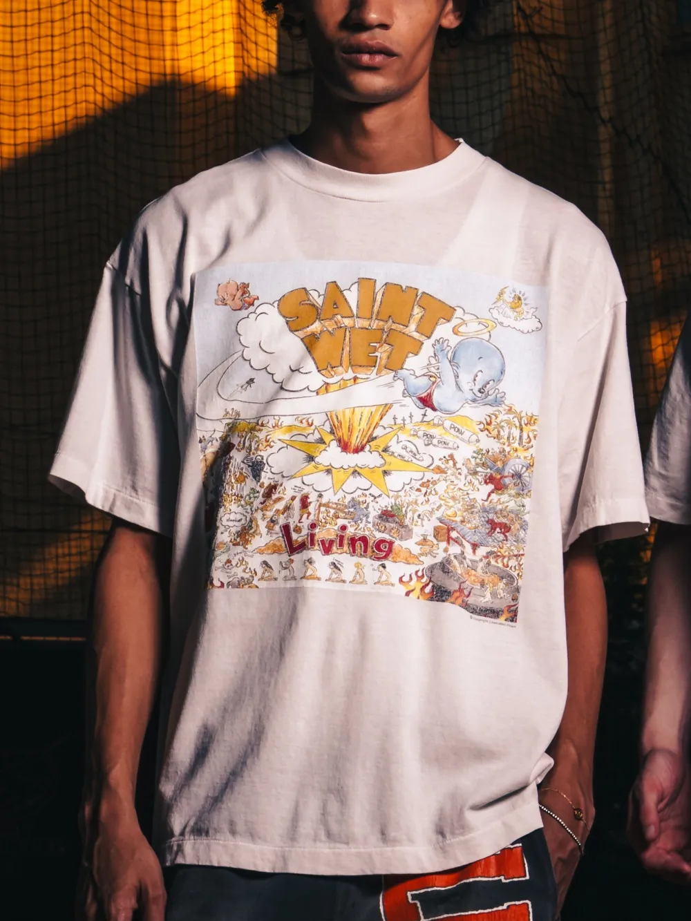White t-shirts worn by a person, showing the t-shirts fit