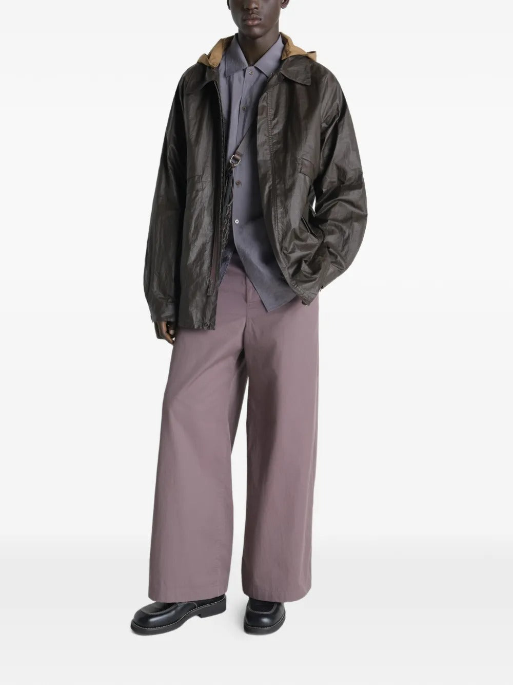 Brown jacket worn by a person, showing the jacket's  fit