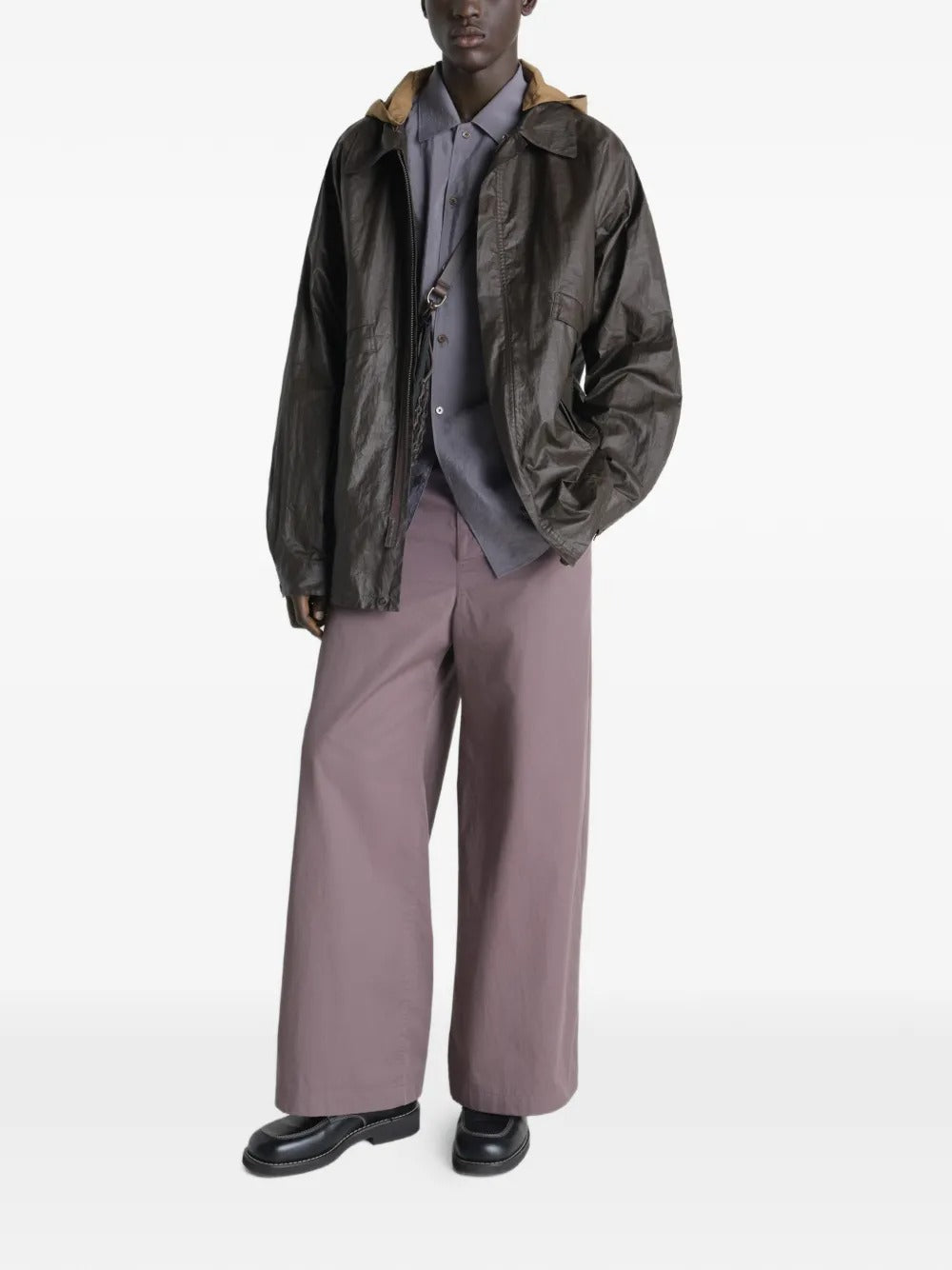 Brown jacket worn by a person, showing the jacket's  fit