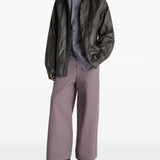 Brown jacket worn by a person, showing the jacket's  fit