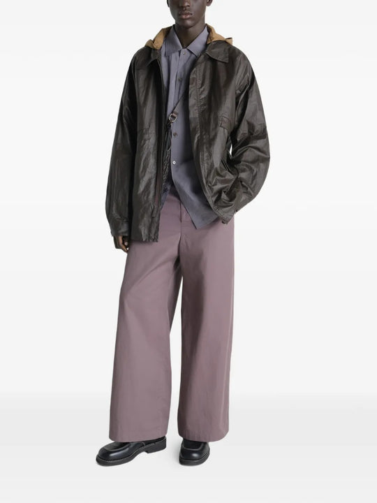 Brown jacket worn by a person, showing the jacket's  fit