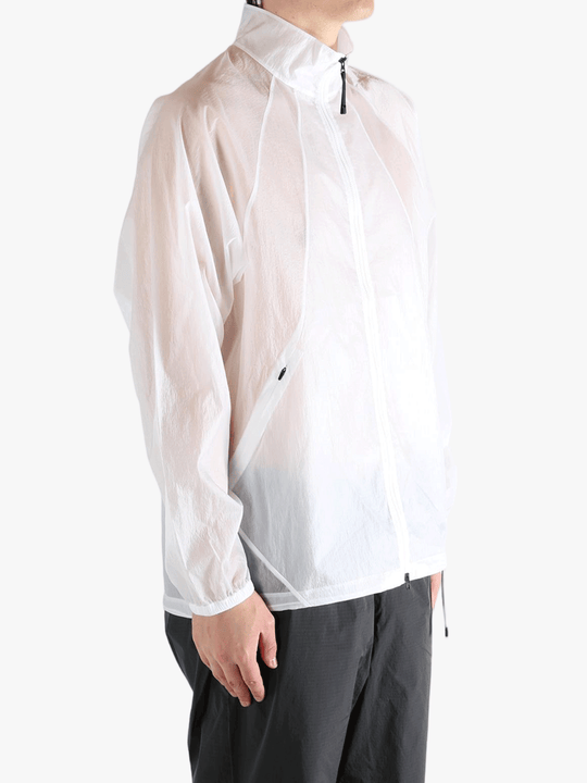 White jacket worn by a person, showing the jacket fit