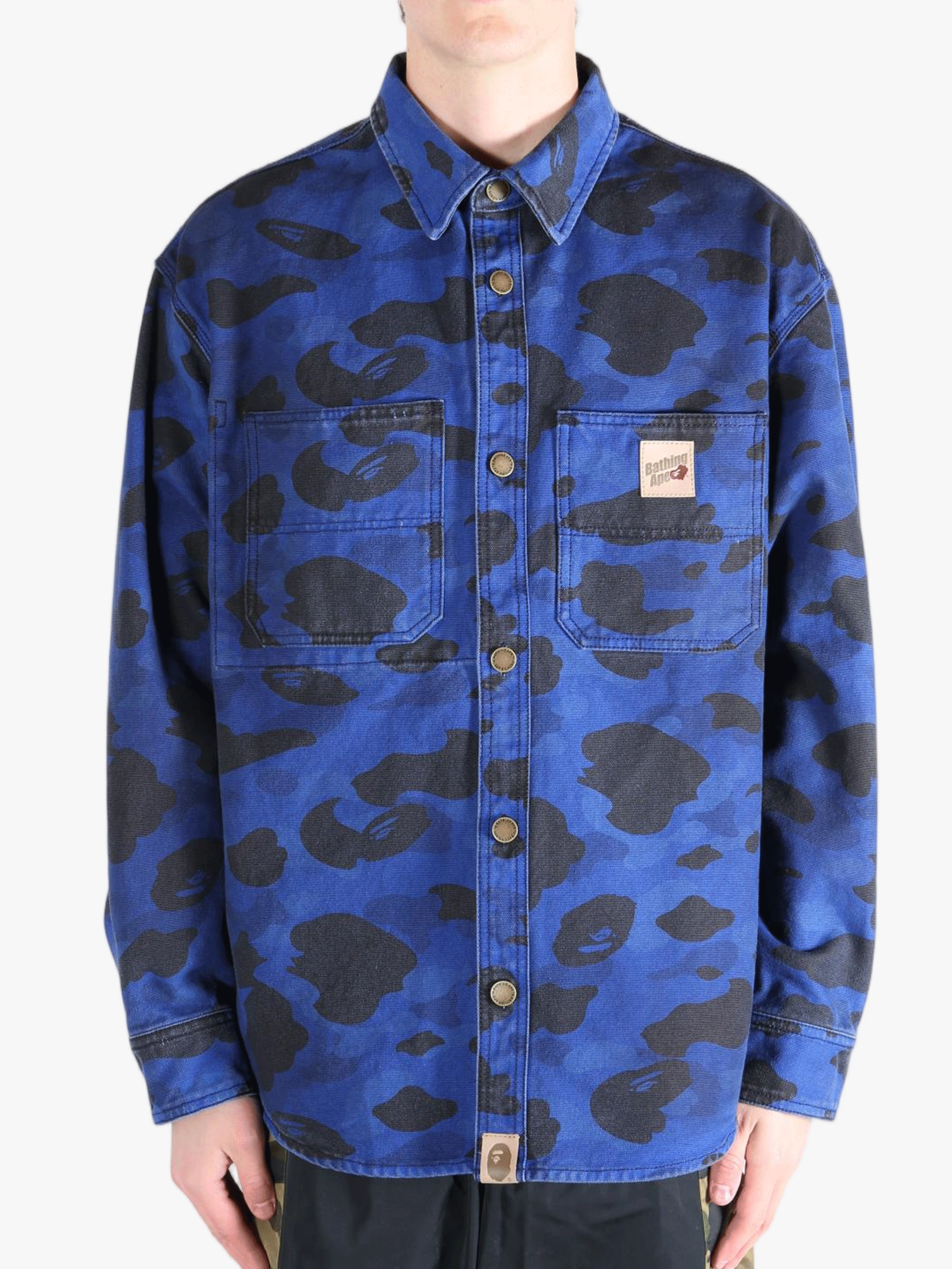 Navy shirt worn by a person, showing the shirt's fit