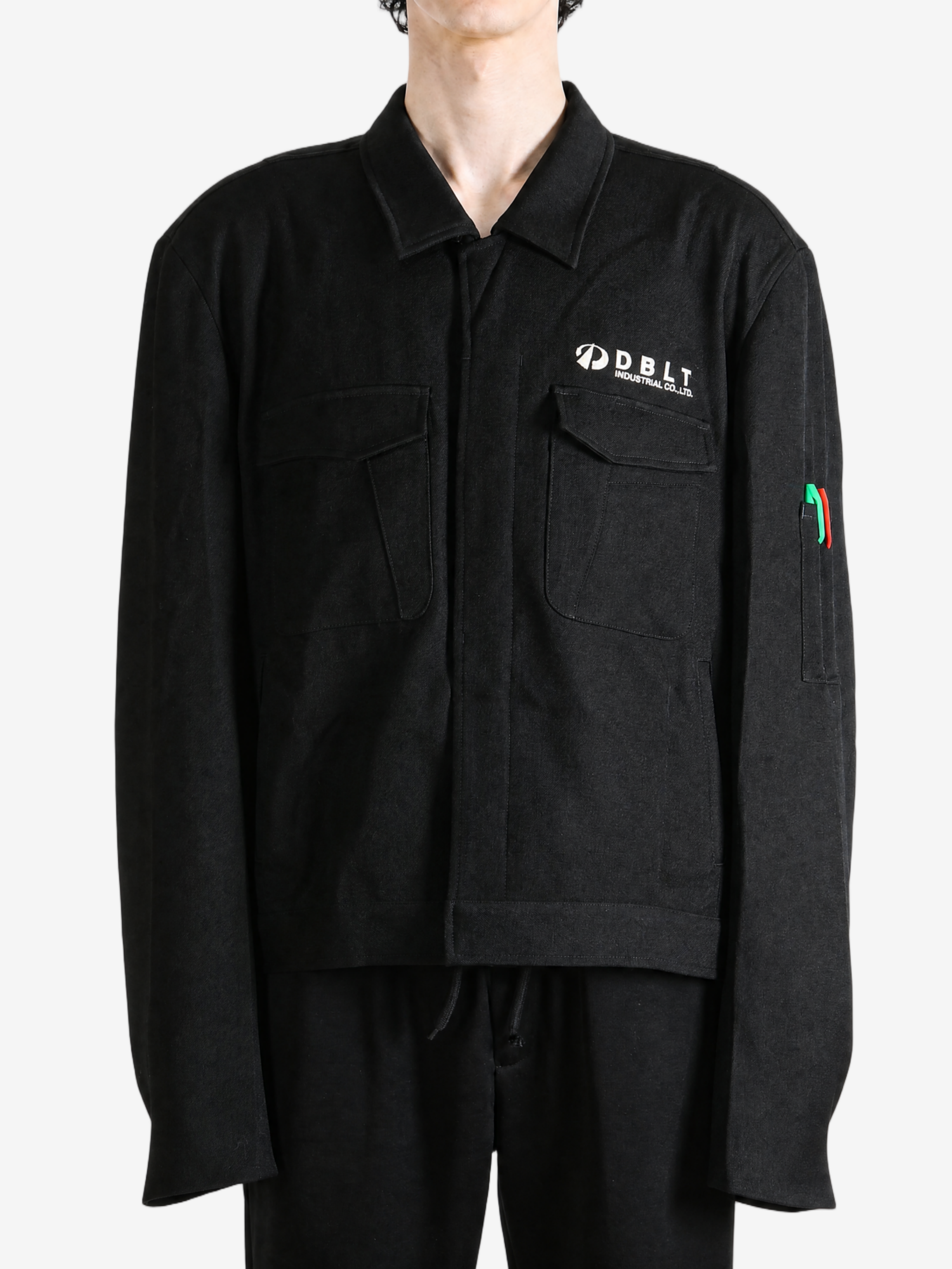 Black jacket worn by a person, showing the jacket fit