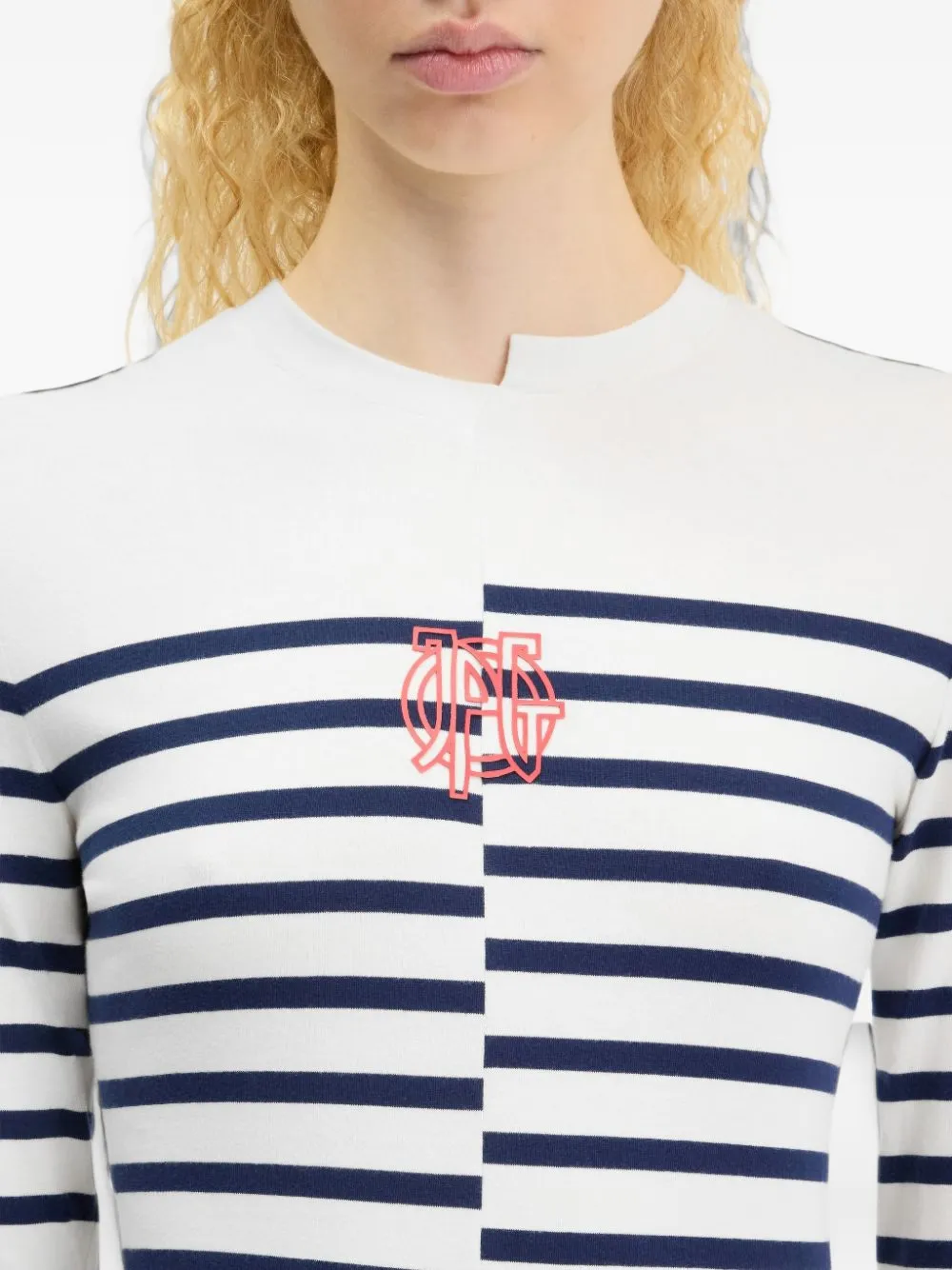 White top worn by a person, showing the top fit