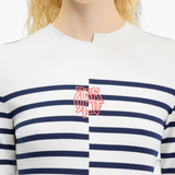 White top worn by a person, showing the top fit