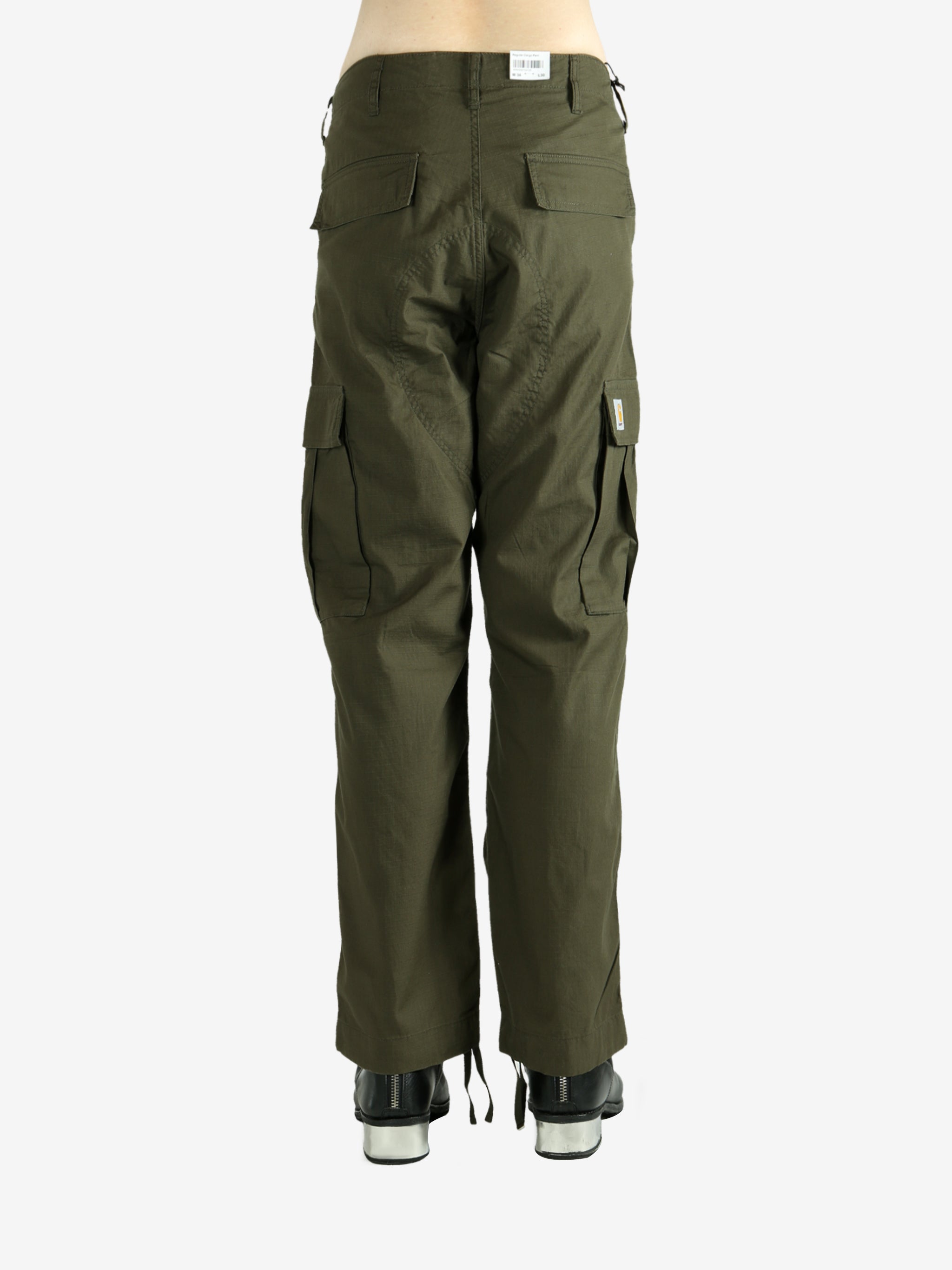 Green pants worn by a person, showing the pants's fit