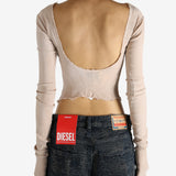 Tan top worn by a person, showing the top's fit