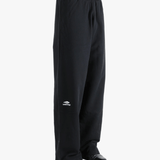 Black pants worn by a person, showing the pants fit