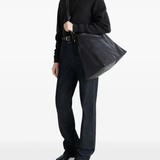 Black bag worn by a person, showing the bag's fit