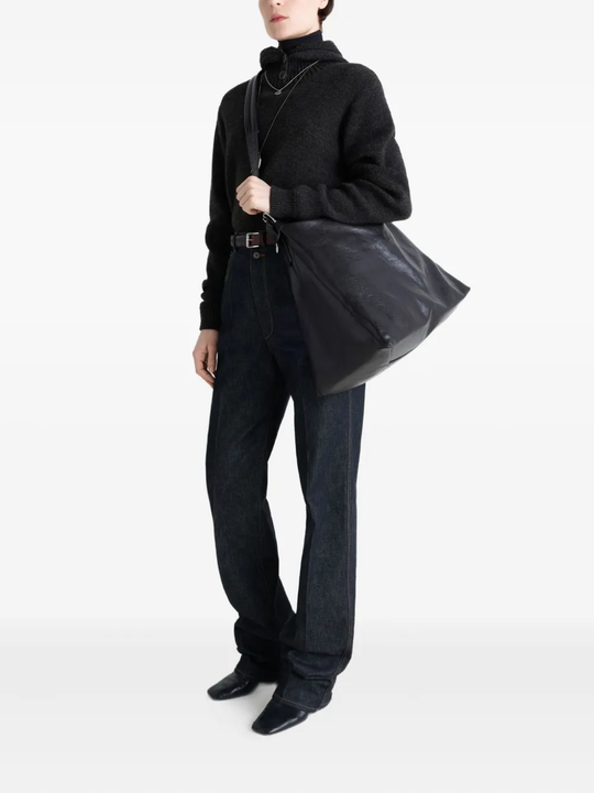 Black bag worn by a person, showing the bag's fit