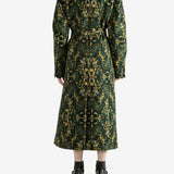 Green coat worn by a person, showing the coat's fit