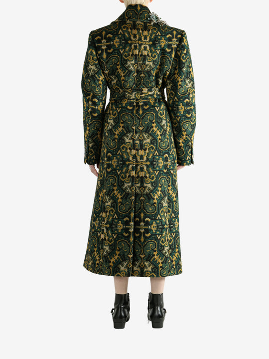 Green coat worn by a person, showing the coat's fit