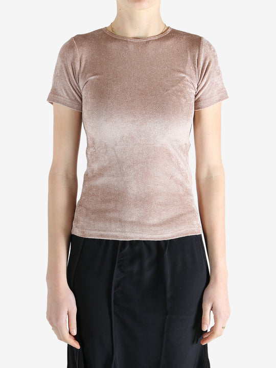 Pink t-shirt worn by a person, showing the shirt's fit