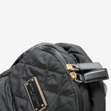 Close up of black bags, showing texture of the polyester fabric