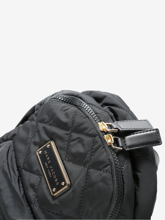 Close up of black bags, showing texture of the polyester fabric