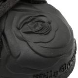 Close up of the black sneakers,showing texture of the blended fabric