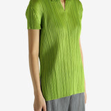Green shirt worn by a person, showing the shirt's fit