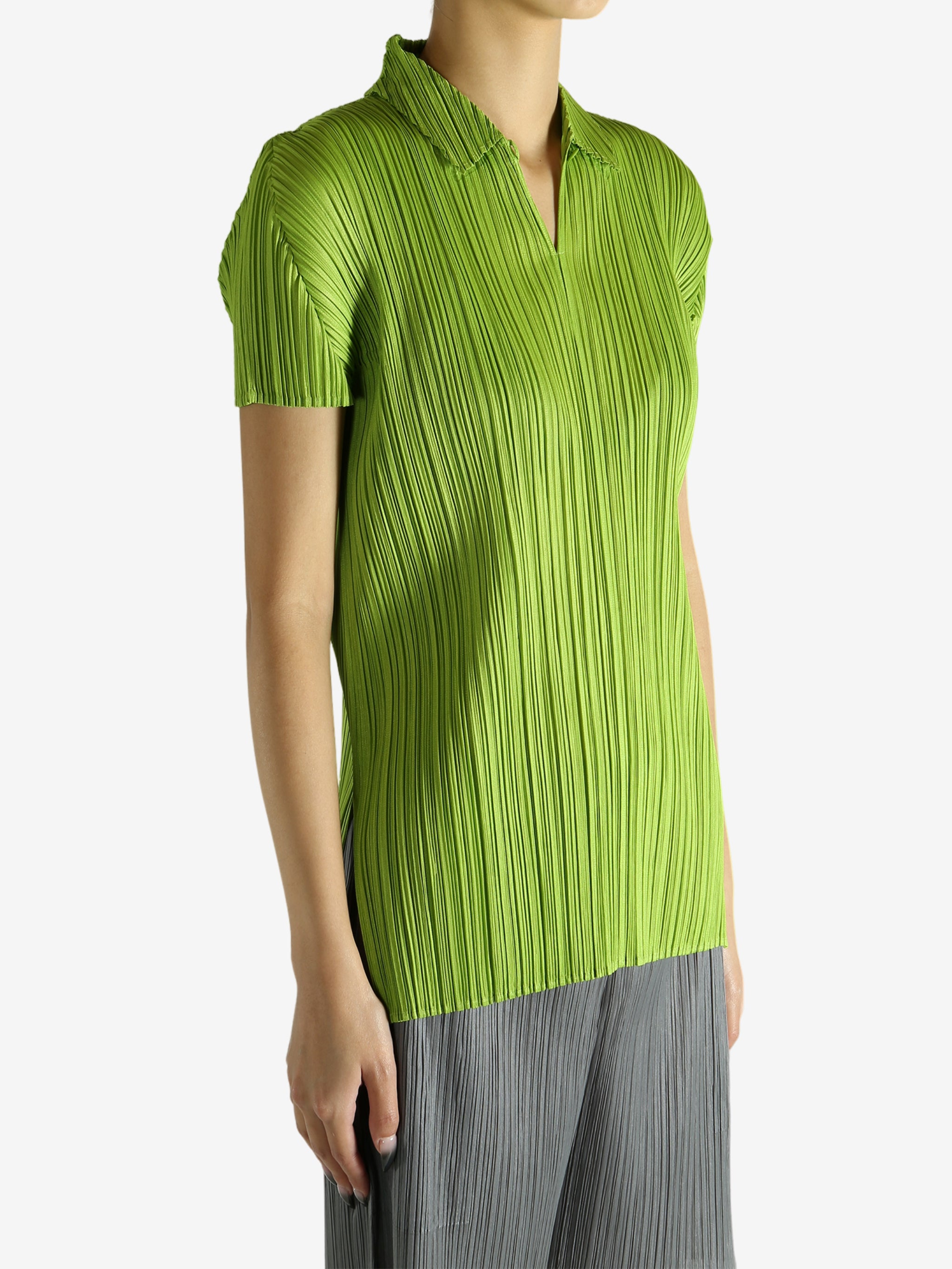 Green shirt worn by a person, showing the shirt's fit