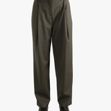 Brown pants worn by a person, showing the pants's fit