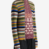Burgundy knitwear worn by a person, showing the knitwear fit