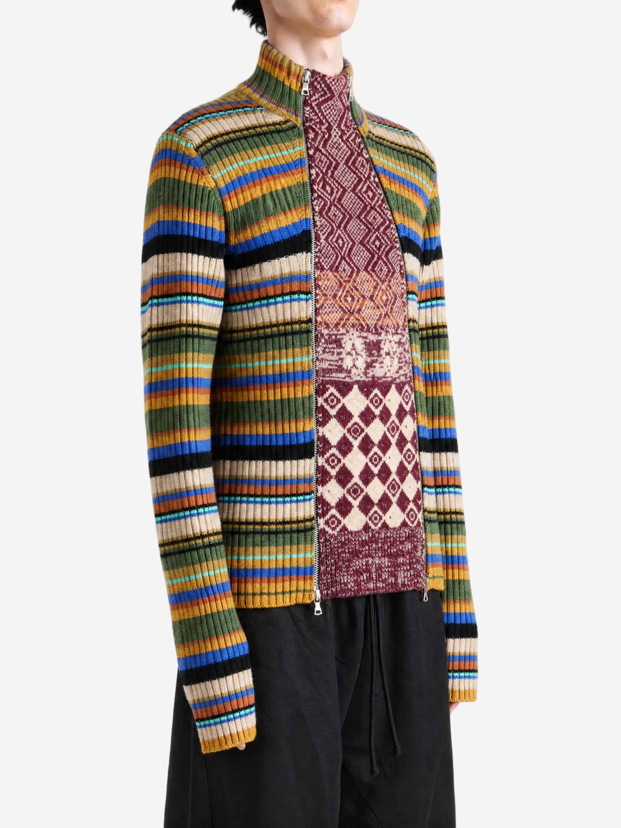 Burgundy knitwear worn by a person, showing the knitwear fit