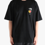 Black tee worn by a person, showing the tee fit