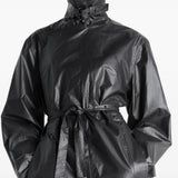 Black coat worn by a person, showing the coat's fit