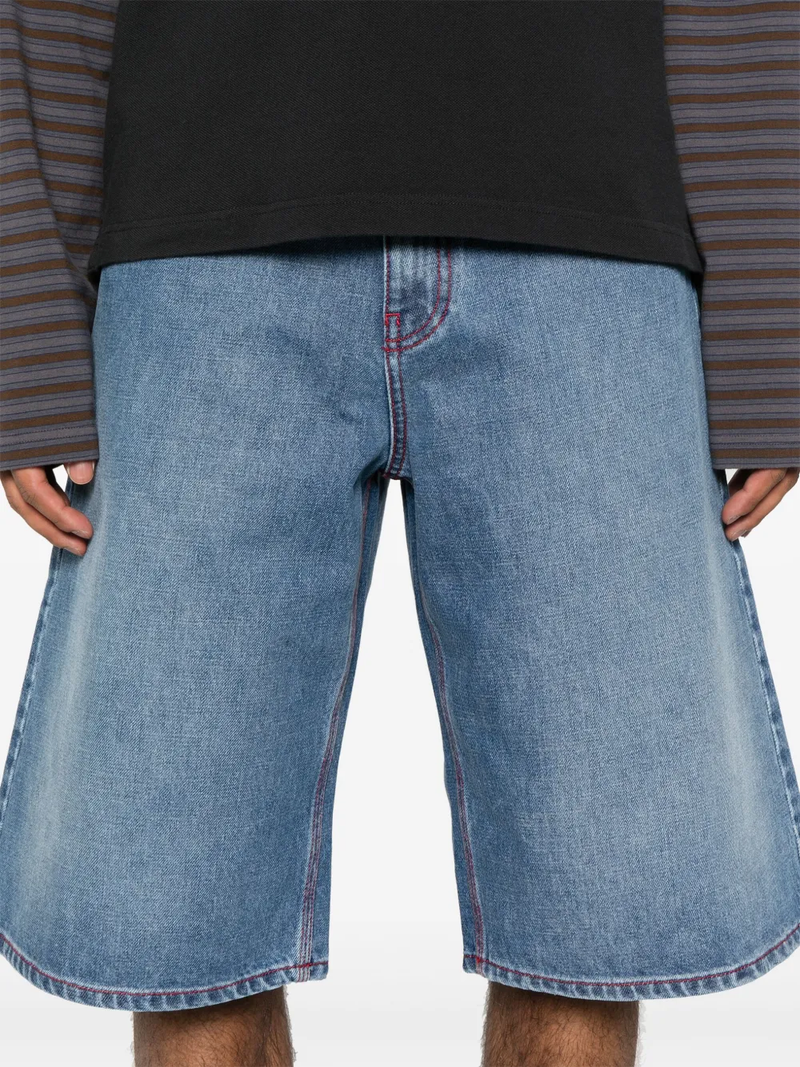 Close up of blue jeans, showing texture of the cotton fabric.