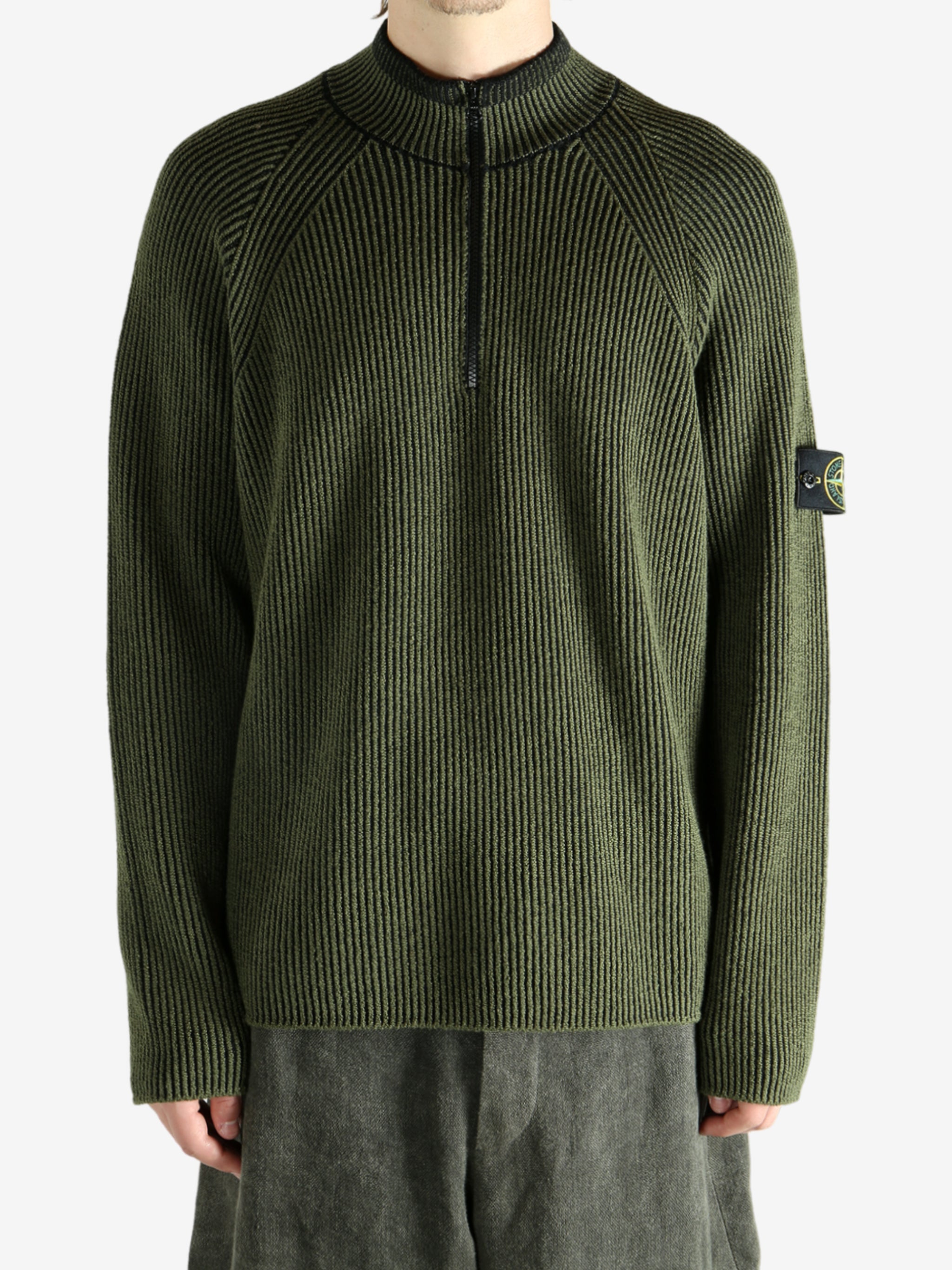 Green shirt worn by a person, showing the shirt's fit