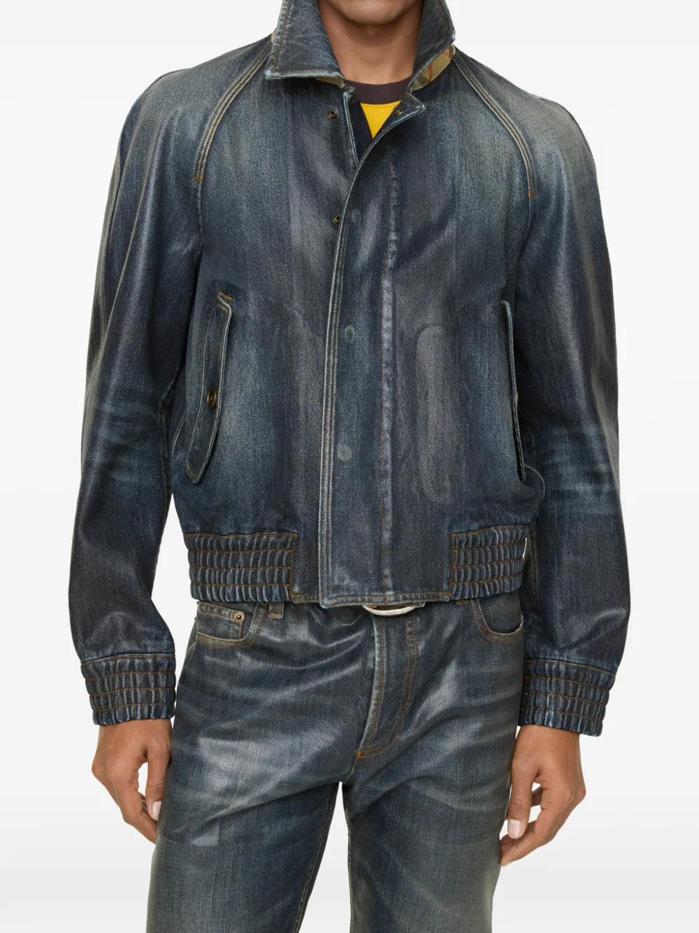 Blue coats worn by a person, showing the coats fit