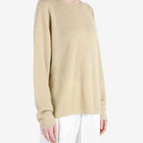 Tan knitwear worn by a person, showing the knitwear fit