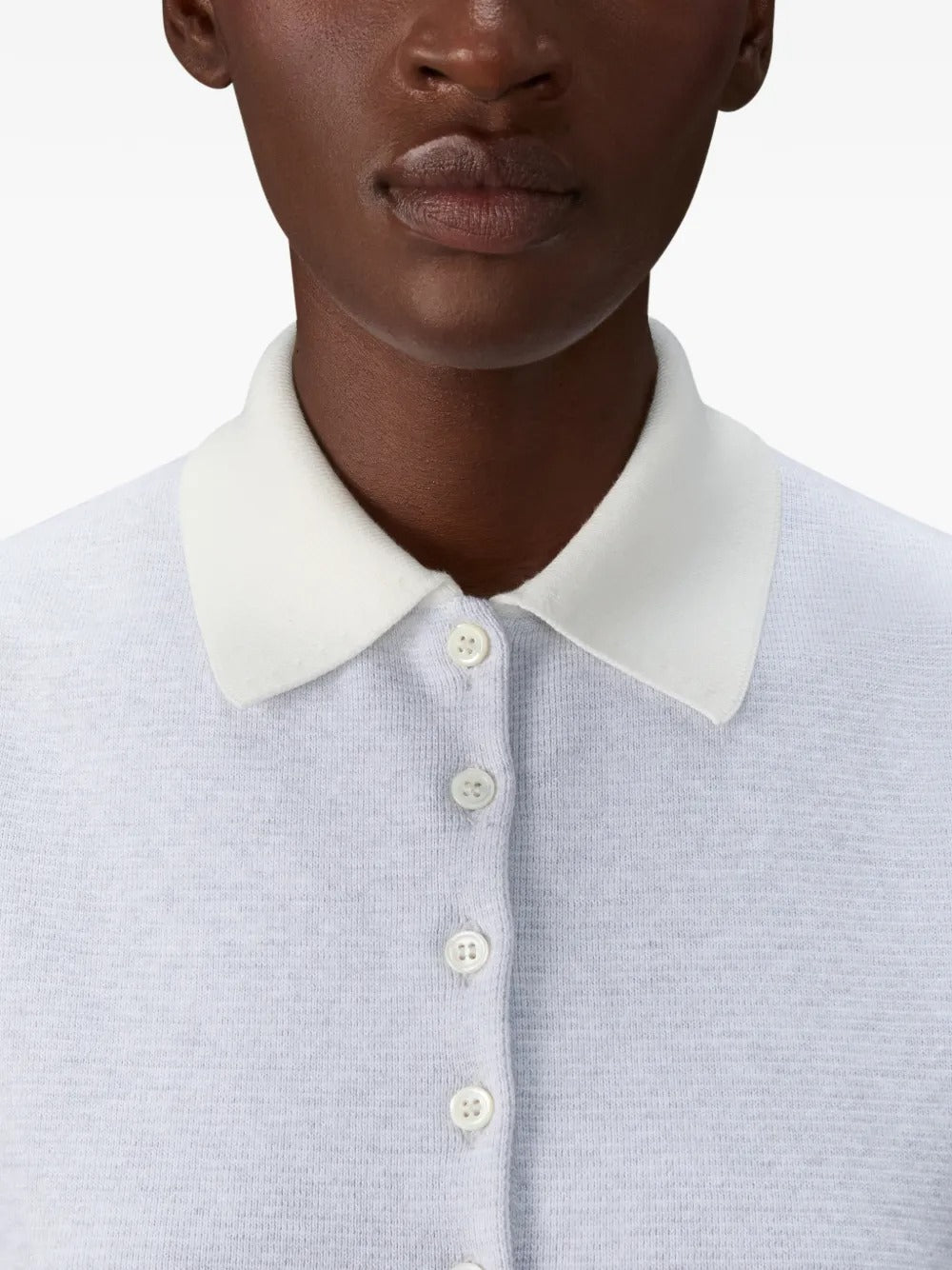 Close up of grey shirts, showing texture of the cotton fabric