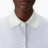 Close up of grey shirts, showing texture of the cotton fabric