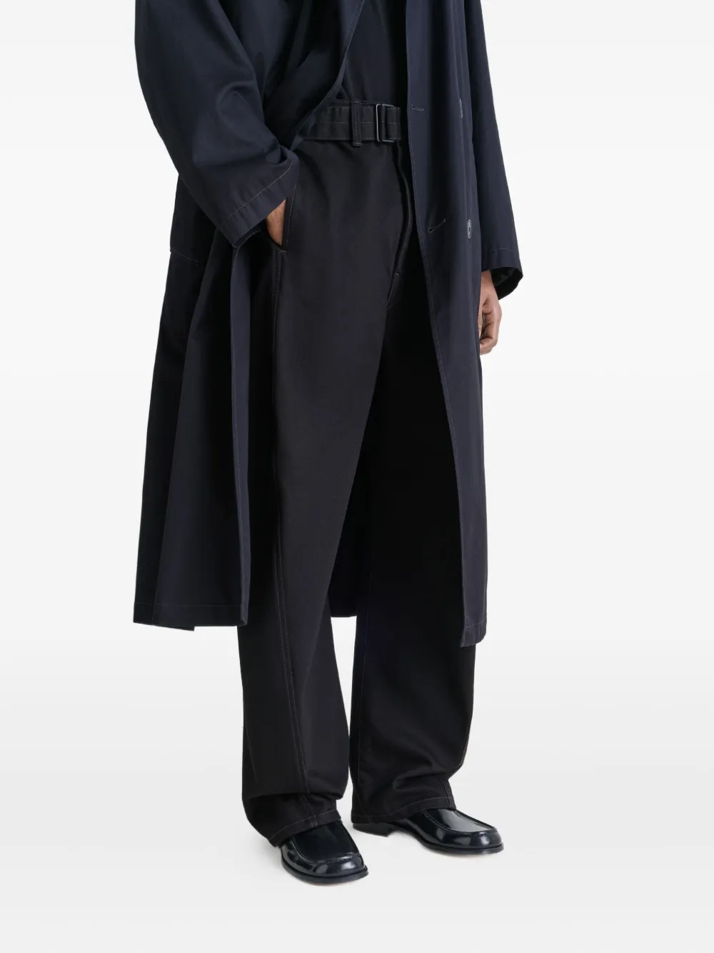 black loafers-mules worn by a person, showing the loafers-mules fit